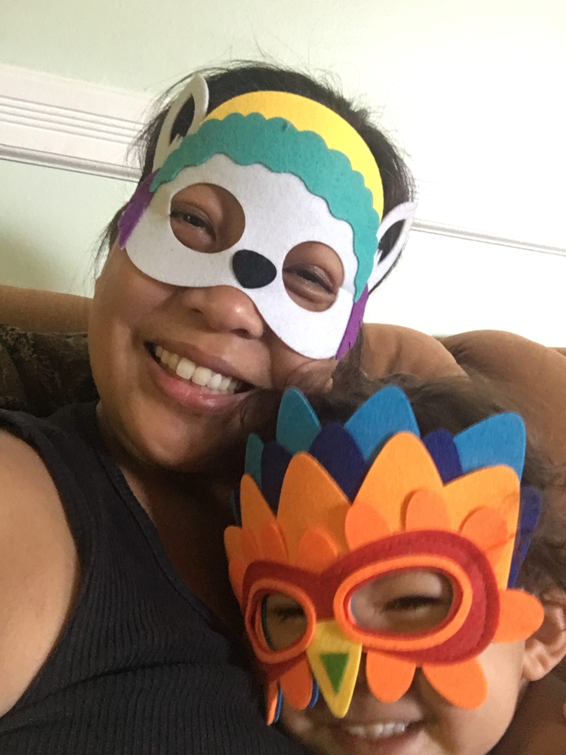 Asian mom and daughter in felt masks.